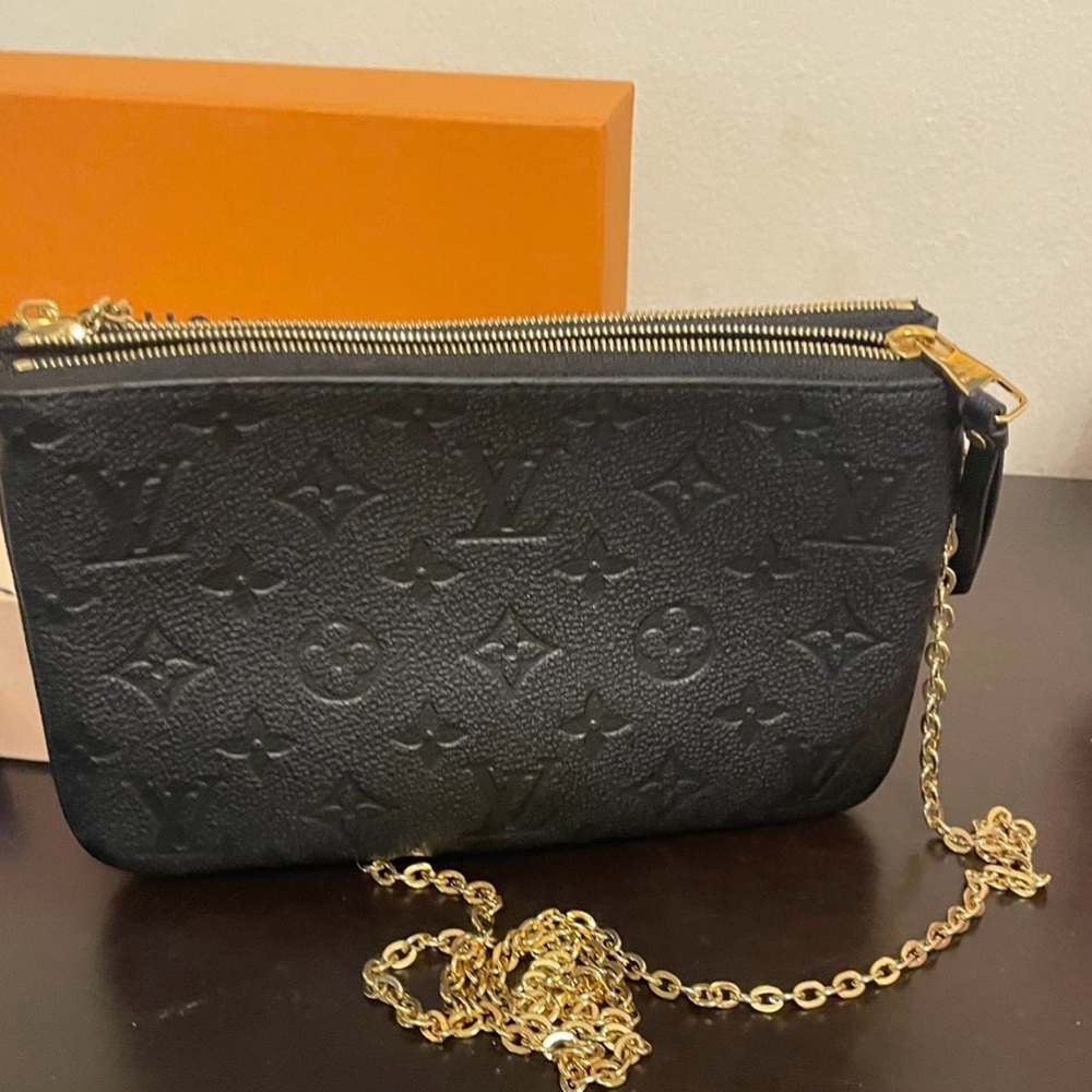 Authantic Louis Vuitton Black cross bag with Monogram Embossed Leather